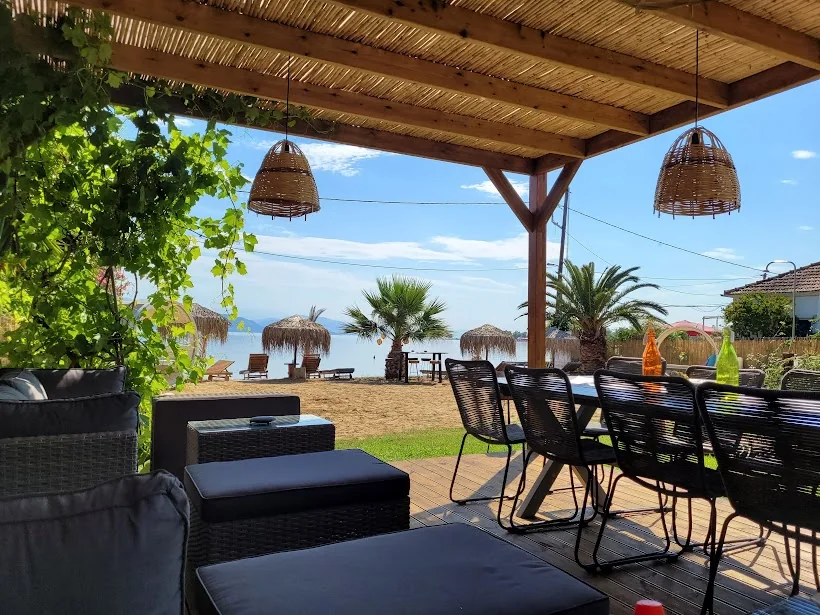 Shaded outdoor lounge facing the beach