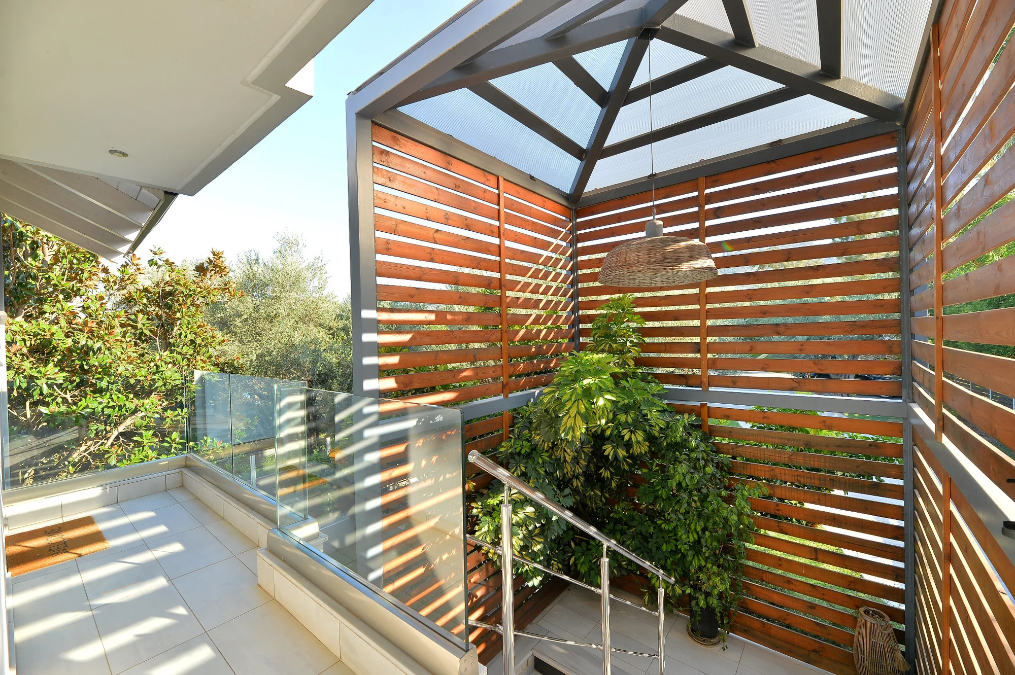 Seacret Apartments building among trees